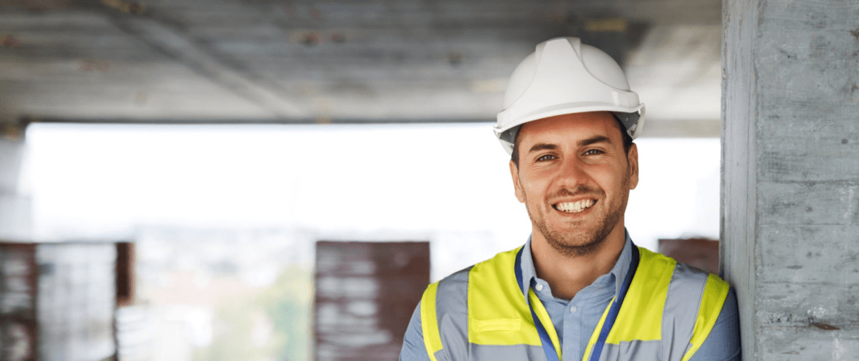 Construction team member on site in hard hat and safety vest